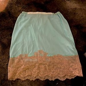 Delicate and beautiful, vintage slip with elastic waist band.